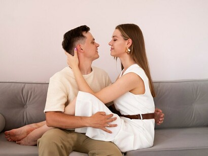 A couple embracing their bond at home, displaying the harmony of emotional intimacy, attraction, and shared compatibility