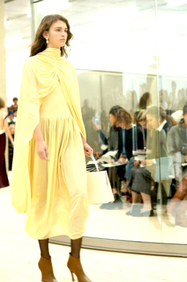 Models walking the runway during a Celine fashion show, showcasing the brand’s latest collection with signature minimalist elegance