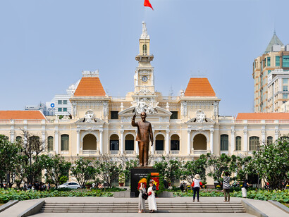 In Ho Chi Minh City, Vietnam, the iconic Ho Chi Minh City Hall (People's Committee Building) stands majestically in front of the modern Vincom Center