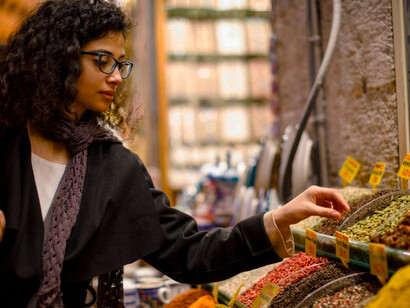 A woman shopping for spices at the Grand Bazaar in Istanbul, Turkey