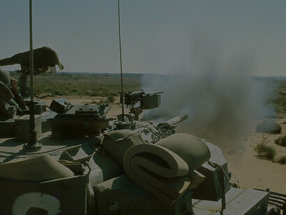 Israeli 105 mm Centurion tank (Sho't) fires main gun during the Yom Kippur War on October 13, 1973, capturing intense combat action