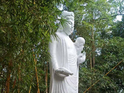 Guan Yin can be historically depicted as genderless or adorning an androgynous apprentice