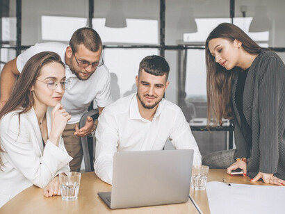 A group of individuals brainstorming a successful business plan in an office setting, radiating happiness, teamwork, and inspiration