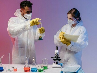 Scientists conducting laboratory experiments with precision and focus, representing the collaborative spirit behind breakthroughs in genomics and biotechnology
