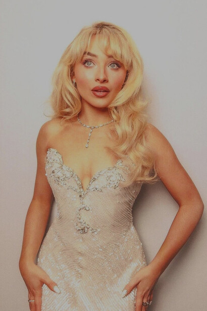 Sabrina's confident stance in this beautiful cream-coloured gown exemplifies her transition into a bold, trendsetting figure in the entertainment industry