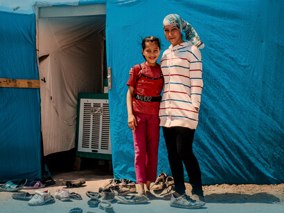 Two Iranian sisters in front of their tent in an Iranian Refugee camp, in Samawah, Iraq