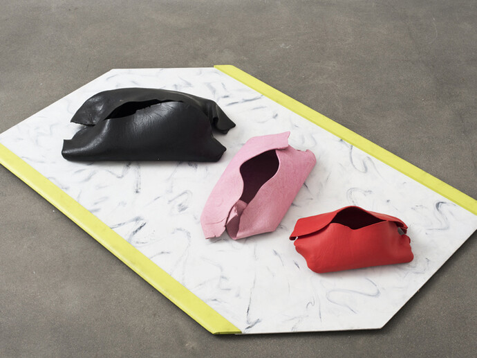 Hannah Wilke, Three Sisters, 1980-84, 3 painted ceramics on painted board, Red: 55.9 x 30.5 x 26.7 cm / 22 x 12 x 10 1/2 ins, Pink: 72.4 x 36.8 x 27.9 cm / 28 1/2 x 14 1/2 x 11 ins, Black: 86.4 x 47.6 x 27.9 cm / 34 x 18 3/4 x 11 ins, Board: 5.1 x 208.3 x 134.6 cm / 2 x 82 x 53 ins, © Marsie, Emanuelle, Damon, and Andrew Scharlatt, Hannah Wilke Collection & Archive, Los Angeles; Courtesy Alison Jacques Gallery, London; Photography Michael Brzezinski
