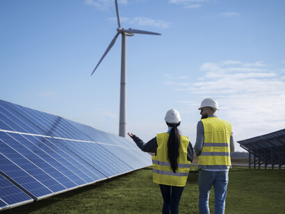 A couple of technicians reviewing different sources of renewable energy