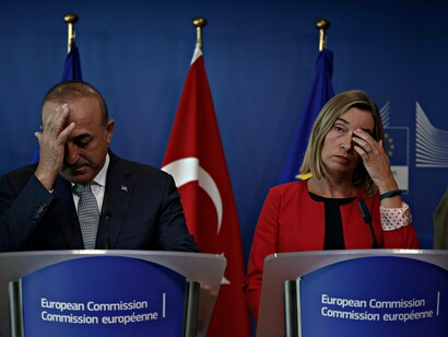The Turkish representative on the left and his female European representative are scratching their heads as to how to accommodate Turkey in the EU
