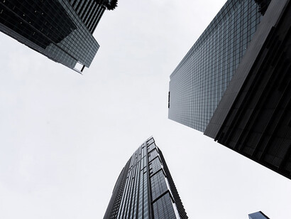 Amidst the urban landscape, a cluster of high-rise buildings stands as a testament to contemporary architecture and the bustling energy of a city on the rise