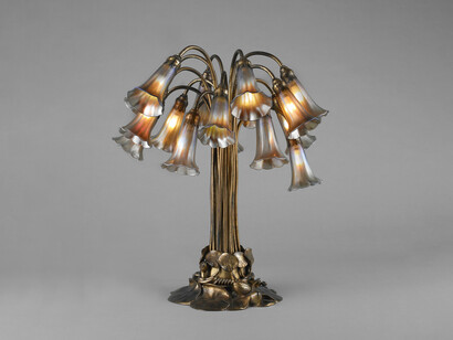 Tiffany Studios (American, 1902-1932). Eighteen-light Lily table lamp, ca. 1910. Favrile glass and gilt bronze. Photo by John Faier © The Richard H. Driehaus Museum