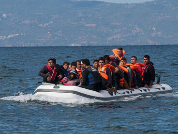 Migrants attempting to reach Greece from Turkey aboard an inflatable boat