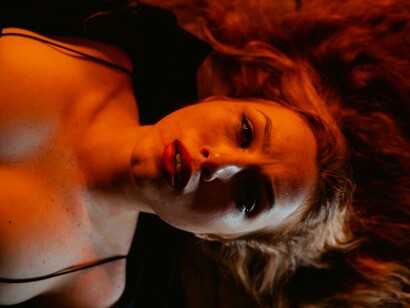 A woman laying on the floor. Internal dialogue is not a mere whisper in the mind; it has real power