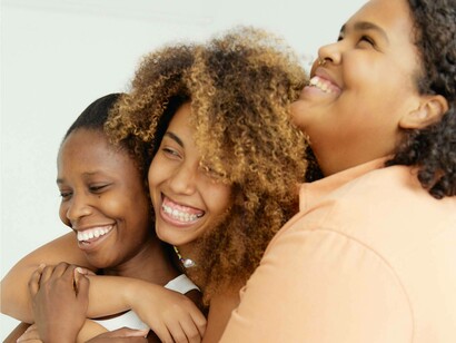 Big smiles from three people who believe that their friendship isn't fake