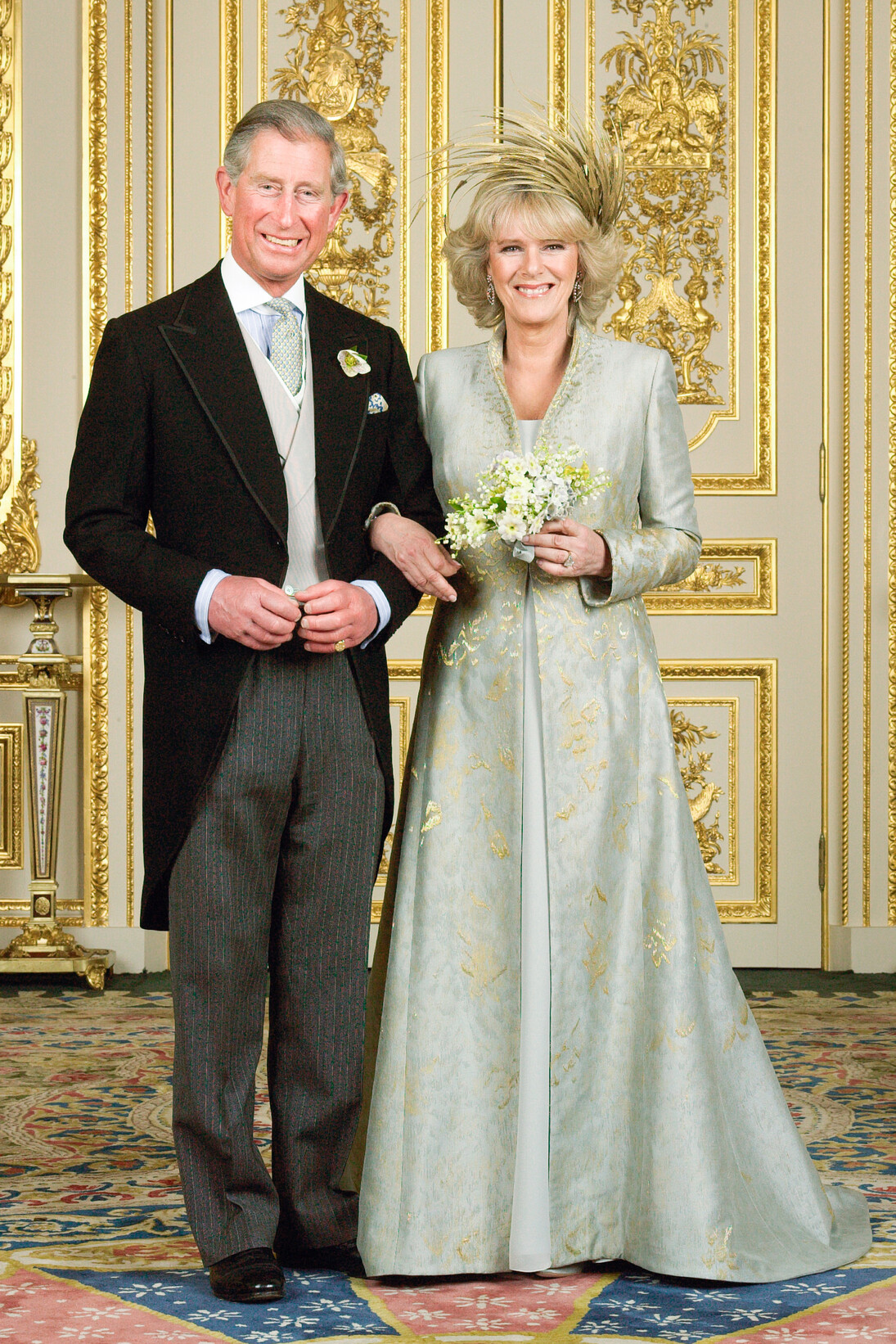 Embroidered silk coat and silk dress designed by Anna Valentine, feather headdress created by Philip Treacy, 2005. Worn by the Duchess of Cornwall. Photograph by Hugo Burnand  