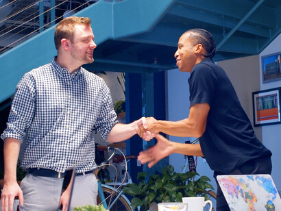 With smiles all around, the leader demonstrates that support and recognition are key to nurturing a motivated and engaged team