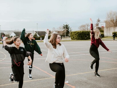 Schoolmates are dialoguing about how to perform their dance choreography and practicing it at the same time