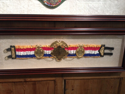 Ken Buchanan, title belt red white blue close up