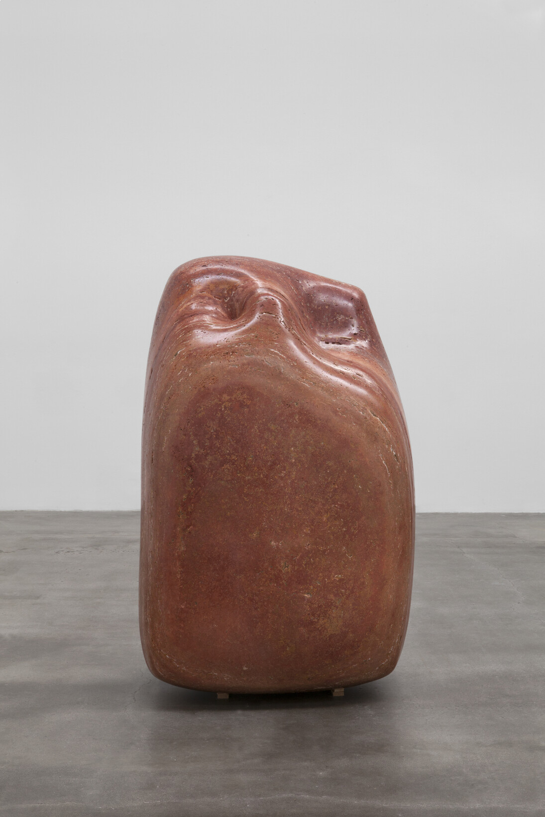 Alma Allen, Not Yet Titled, 2014, Red travertine, 59 x 38 x 29 inches. Courtesy of the artist and Blum & Poe