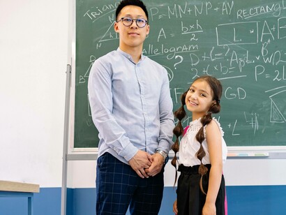 Student and teacher stand together