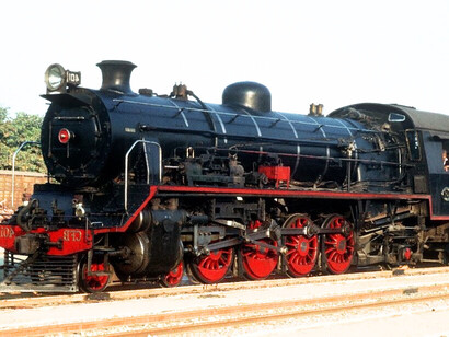 A historic 11th Class 4-8-2 steam locomotive rests at Lobito Station, a reminder of Angola’s colonial-era Benguela Railway