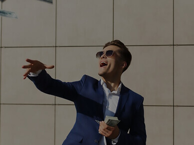 Experience the vibrant energy as a young businessman dances and throws dollars on the street, showcasing his exuberance and spontaneity