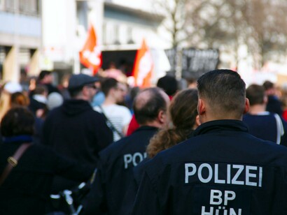 A group of police officers walks down the street, Germany