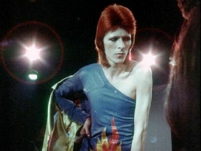 David Bowie performs onstage during his "Ziggy Stardust" era in 1973. (Photo by Michael Ochs Archives/Getty Images)
