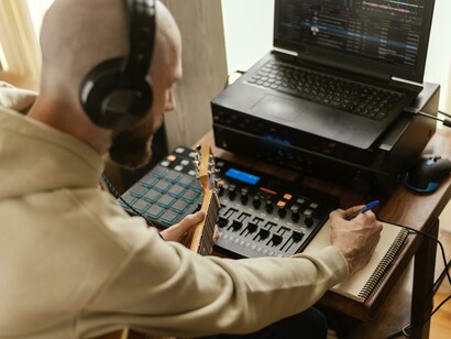 A skilled artist in the studio, transforming everyday sounds into expressive compositions