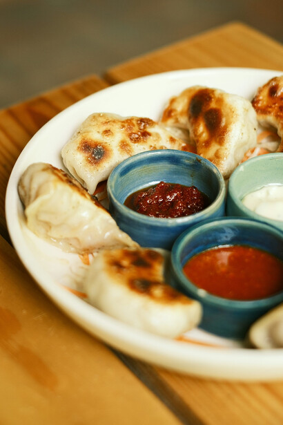 An enticing arrangement of momos on a table, representing a staple of Nepali cuisine