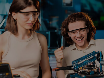 Innovative students, adorned in protective eyewear, enthusiastically conduct robotics experiments in a laboratory setting, showcasing hands-on STEM education