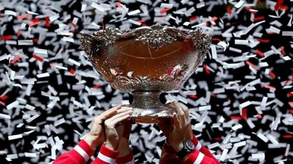 Stanford University title in tennis being hoisted by the entire team