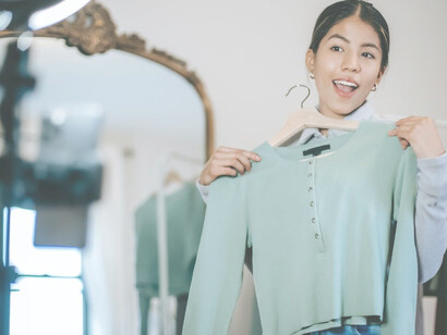 In the realm of affiliate marketing, an influential woman strikes a pose while promoting a product with grace and persuasion