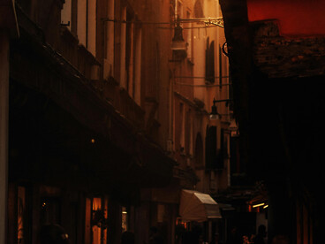 An old Cairo street at sunset, its dimly lit alleys glowing with nostalgic charm, Egypt
