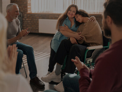 A supportive mental health community gathered for a psychological therapy session