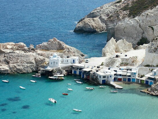 A bird's eye view of the Milos Island in the Aegean sea, symbolizing the transformation of Milos into an increasingly sophisticated island escape