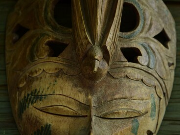 A hand-carved African ceremonial mask, representing the spiritual and cultural traditions passed down through generations