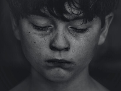 A boy is feeling sad and cries
