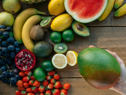 An array of fruits over a table, a reminder that proper nutrition is essential for optimal healing outcomes