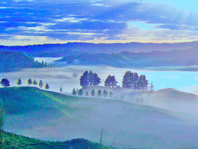 Evaporation fog over landscaping and mountains