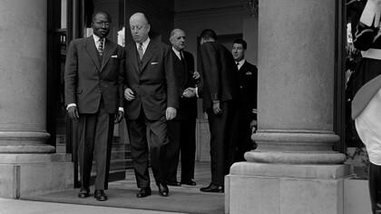Leopold Sedar Senghor, Senegalese president, leaving Elysee, Paris, with Jacques Foccart, 8 May, 1964