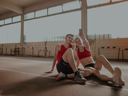 A couple posing for a selfie after a workout