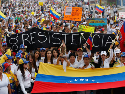Venezuelan protestors march the streets for their political rights