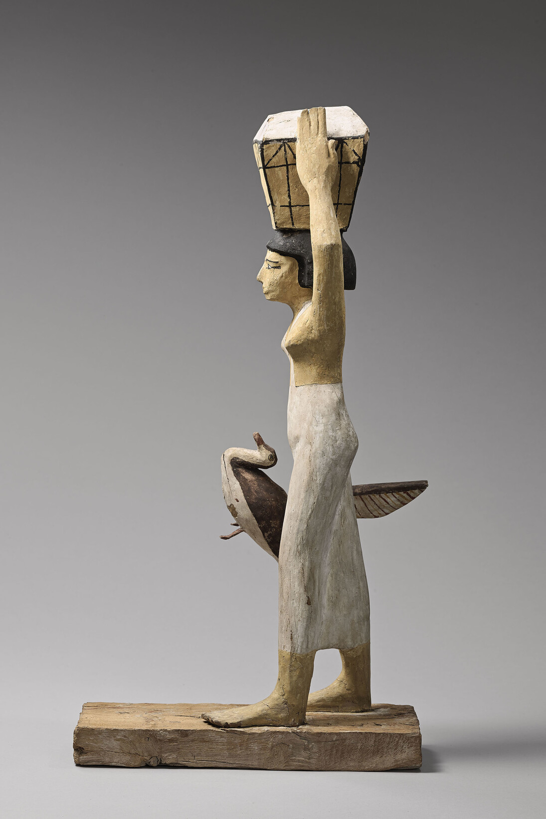 Statuette of woman bearing offerings, Stuccoed and painted sycamore fig wood, Middle Kingdom, 12th Dynasty (1963-1786 BC), Asyut, Tomb of Upuautemhat © Musée du Louvre, Dist. RMN-Grand Palais / Raphaël Chipault