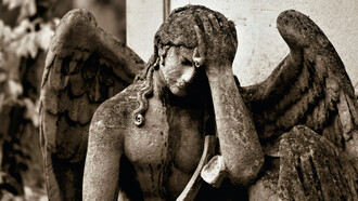 Statue of an angel, full of sadness