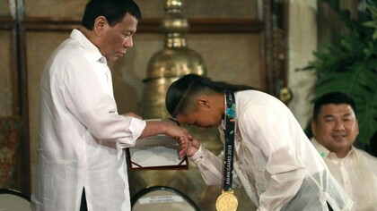 skater Margielyn Didal shows respect to President Rodrigo Roa Duterte at Malacañan Palace, Manila, Philippines, 2018