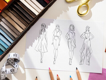 Key elements of fashion design in the studio: fabrics and sketches arranged on the table