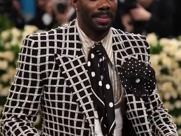 Colman Domingo in Valentino, wearing a black-and-white windowpane tailored suit, patterned tie during the 2025 Met Gala