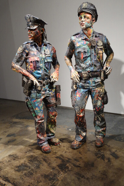 Partners, 2015. Wood, wire, newspaper, tape, glue, matte medium, UV matte varnish, 65 x 26 x 12 inches and 70 x 24 x 12 inches