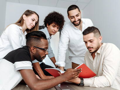 Business professionals engage in strategic discussion, illustrating the role of teamwork within modern innovation ecosystems